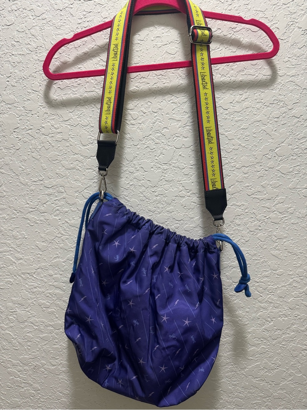 Camila Canabal  Drawstring Crossbody Bag with Yellow Graphic Strap